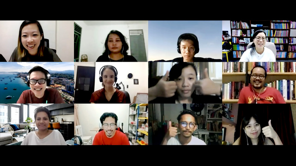 A Zoom session with twelve participants, smiling into their cameras. Three give thumbs-up into the camera as well.
