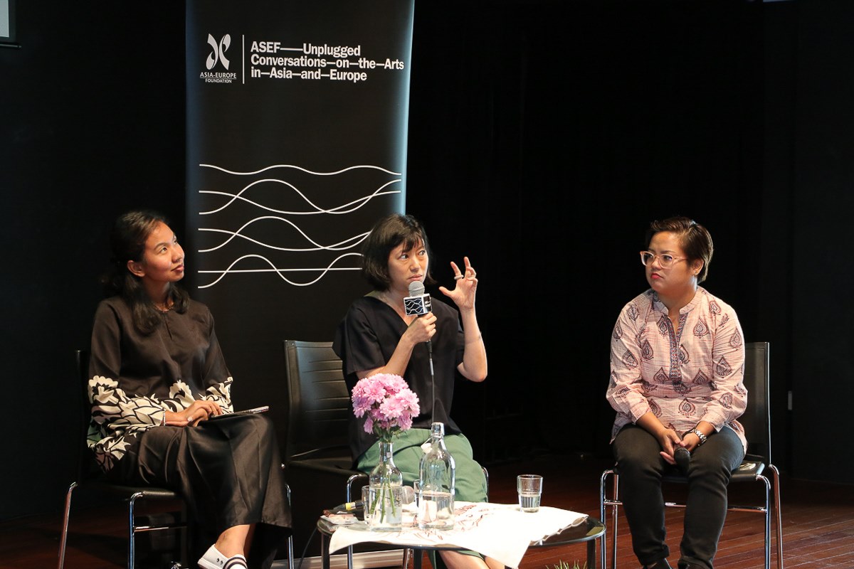 Photograph of ASEF Unplugged Arts Futures, with 3 speakers seated on couches at the Centre 42 Black Box.